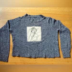 No label medium polyester cotton blend crop sweater with hand drawn silk screen.